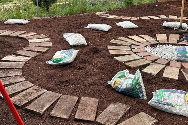 Brick wall in shades of brown and tan.